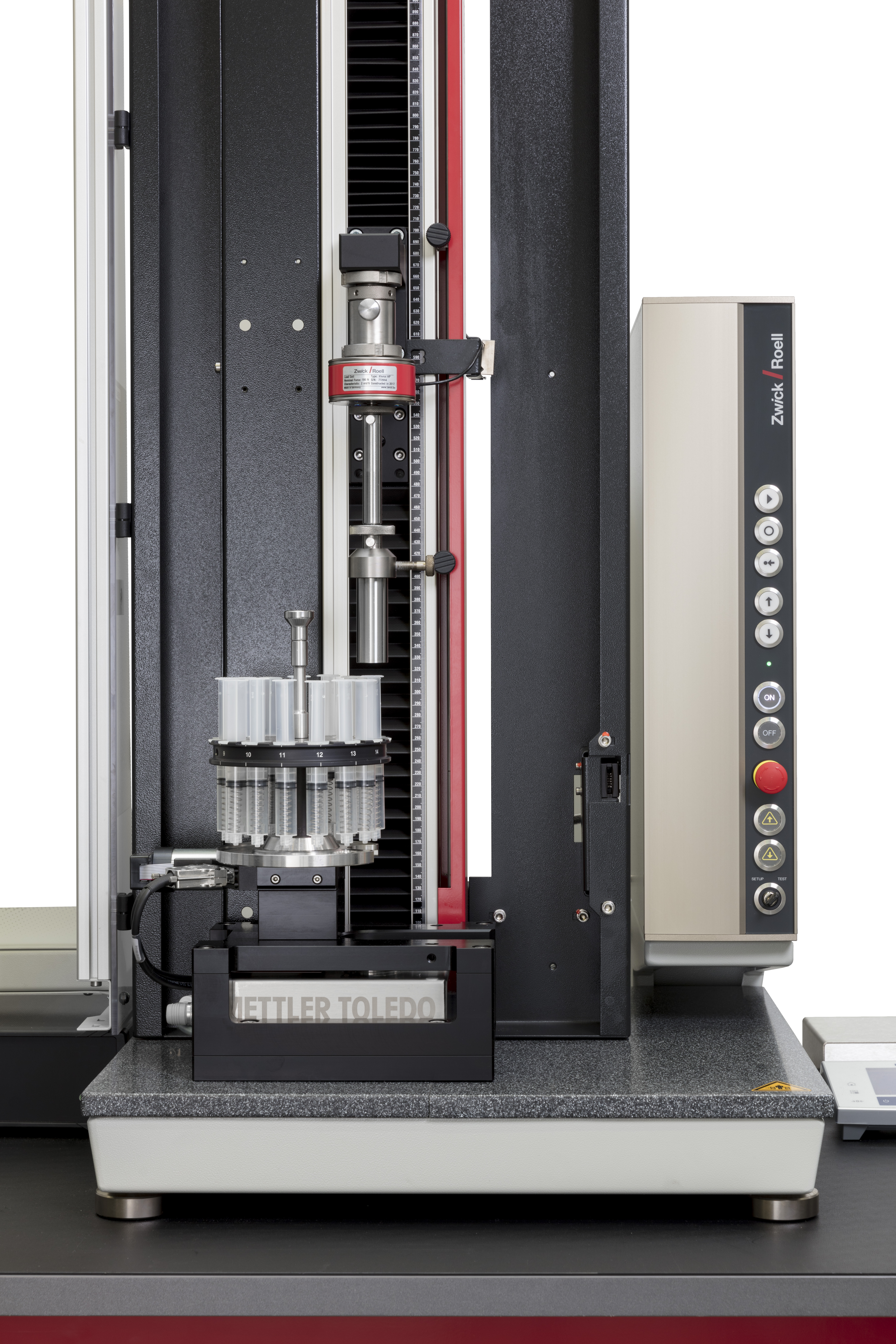 Carousel system for high-precision testing of dose accuracy, breakaway and glide forces on syringes