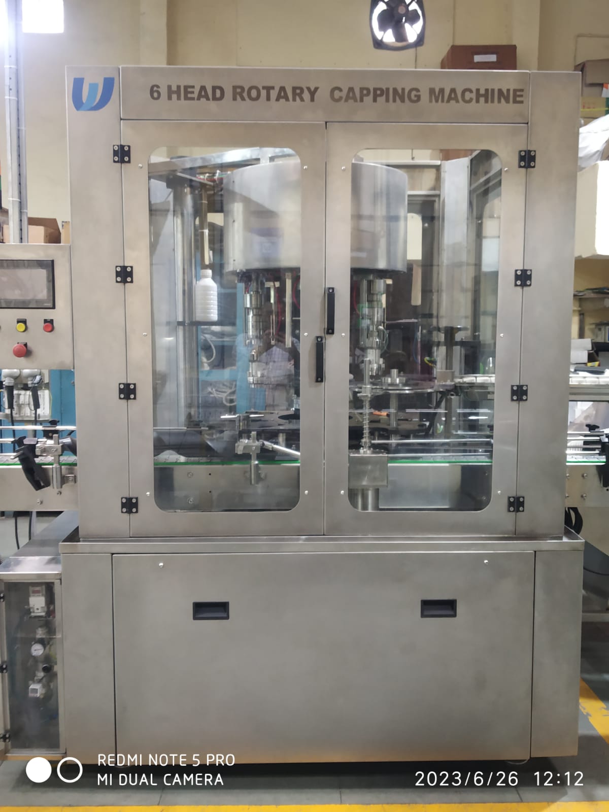 CONTINUOUS ROTARY CAPPING MACHINE WITH DIGITAL TORQUE CONTROL