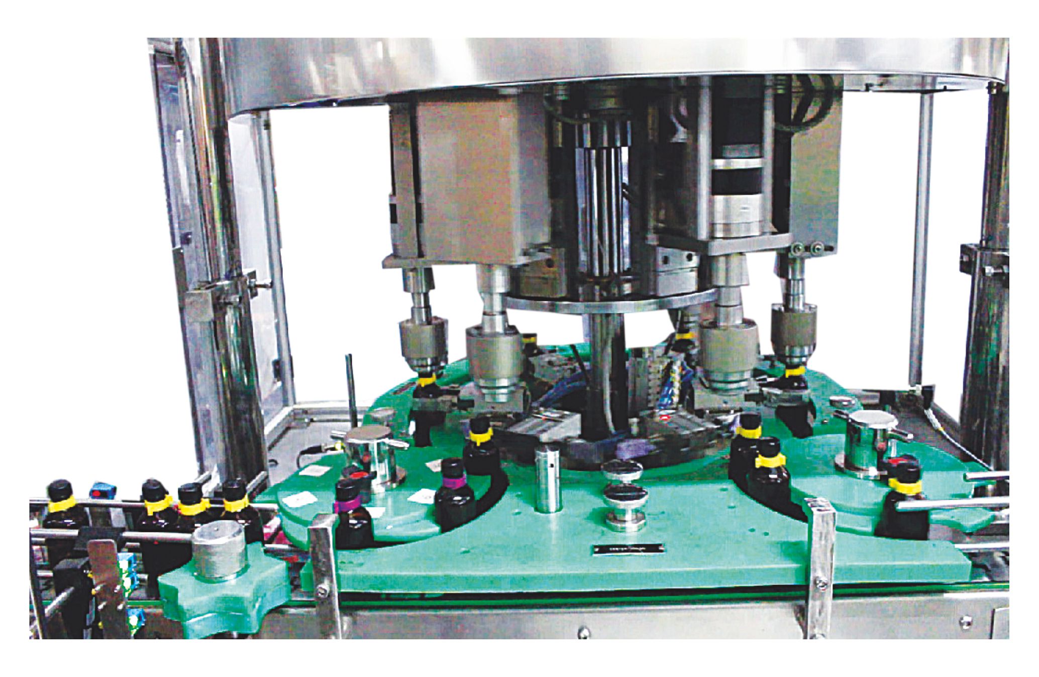 CONTINUOUS ROTARY CAPPING MACHINE