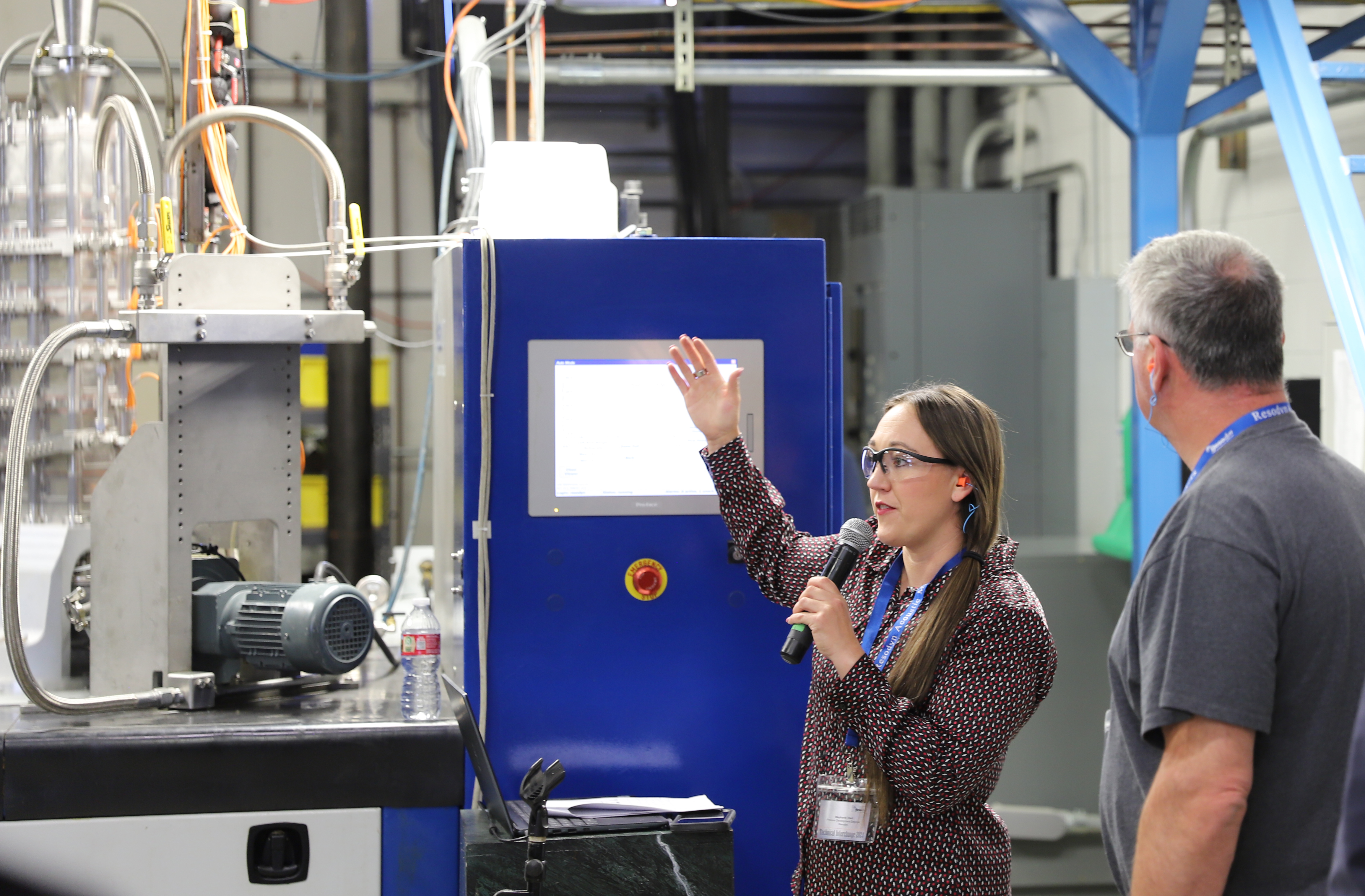 Engineer Stephanie Trant demonstrates one of the RAM5 mixers.
